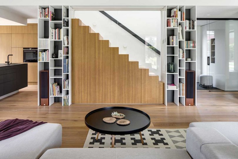 modern living room in concrete, wood, and white surfaces