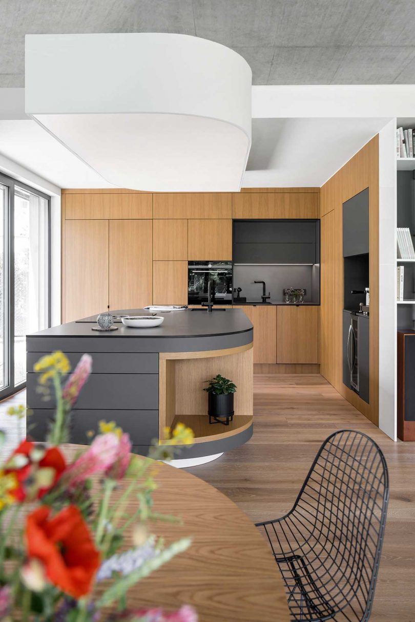 look into modern wood and black kitchen