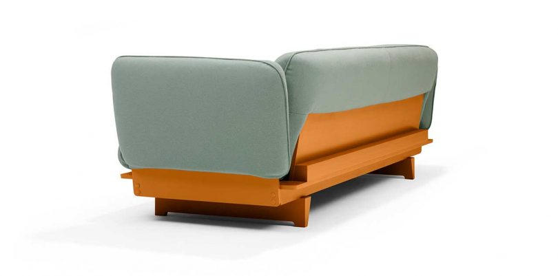 FLOAT SOFA in green fabric with ocre base