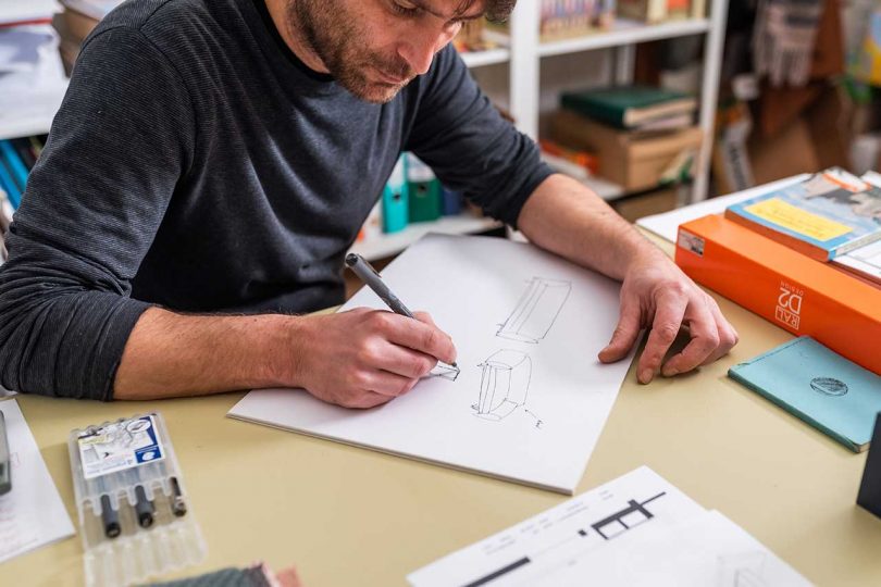 Designer sketching prototype drawings