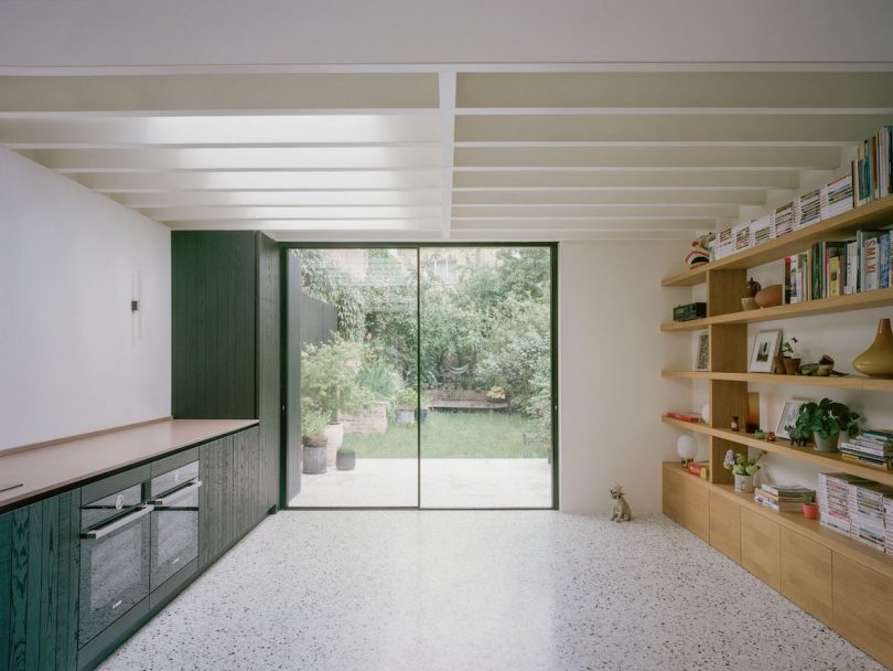 The kitchen is illuminated by three skylights overhead