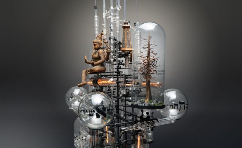 Buddha sculpture and tree within "Day I B" sculpture