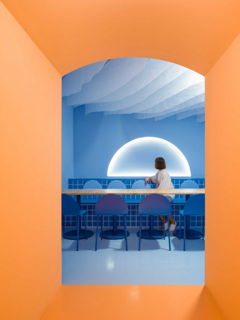 modern restaurant interior featuring blue and peach tones