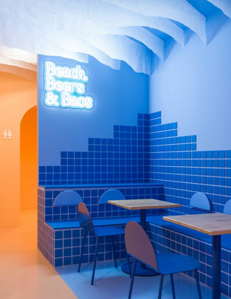 modern restaurant interior featuring blue and peach tones