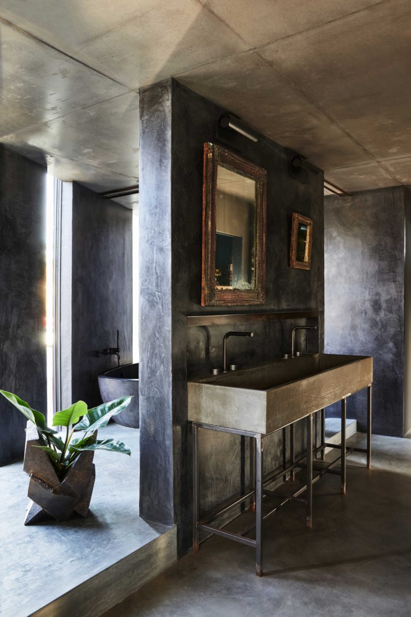 interior of modern industrial bathroom with double sink