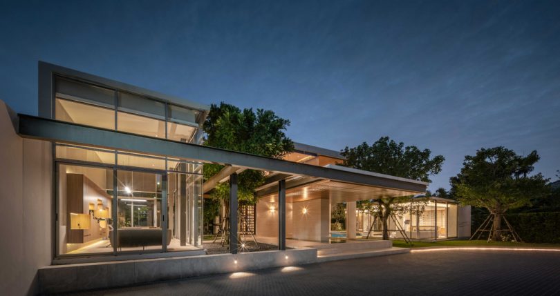 night shot of exterior of lit-up modern house