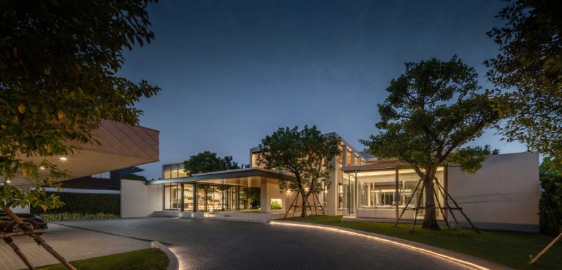 night shot of exterior of lit-up modern house