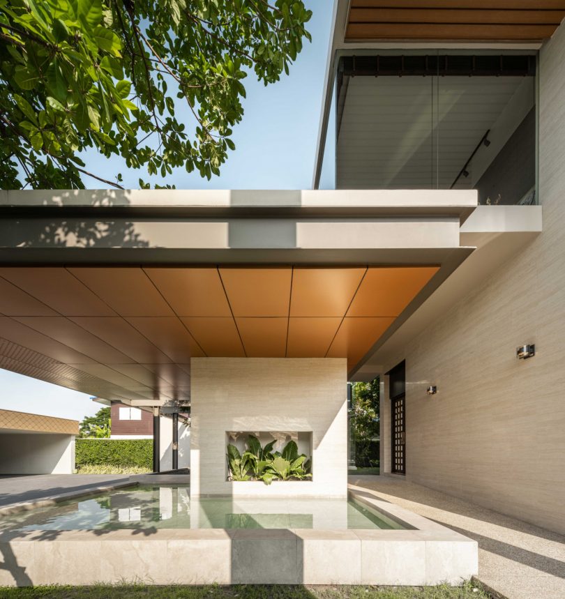 courtyard of Bangkok home with covered pond