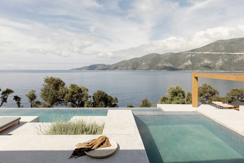 exterior of modern house looking out to minimalist pool and out to ocean