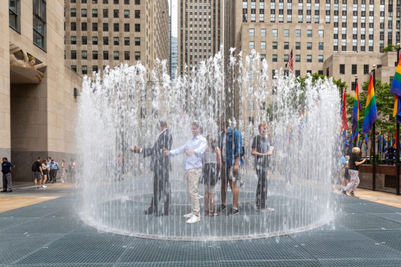 A group poses for cameras in the largest circle