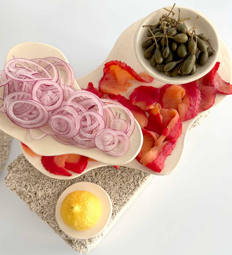 overhead shot of sculptural food displays with onions, tomatoes