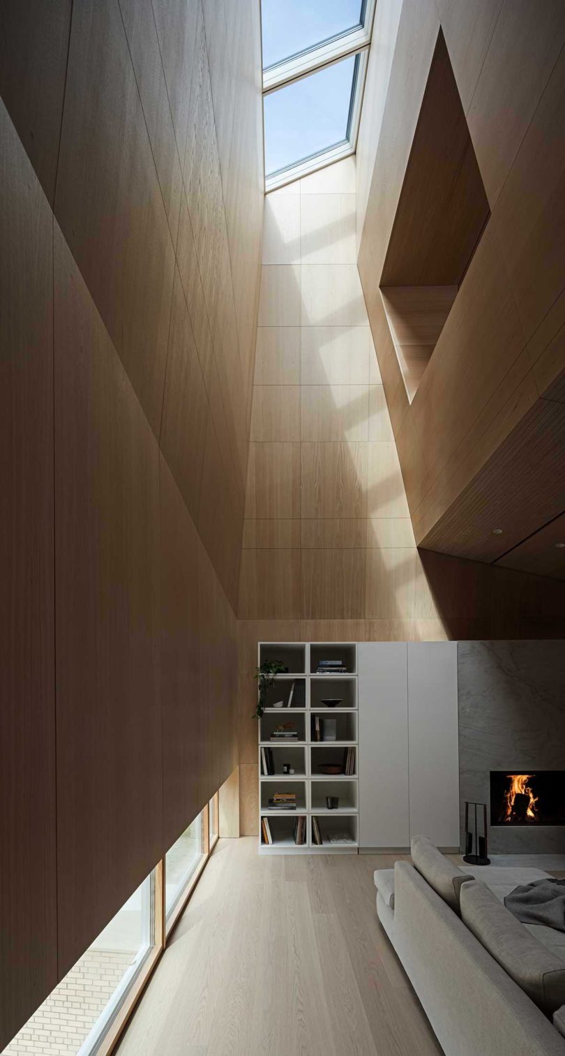 interior view of modern house with living room featuring tall ceilings with skylights