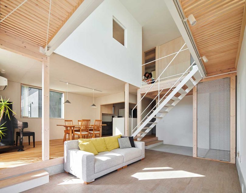 interior of modern Japanese home with double height living room with staircase