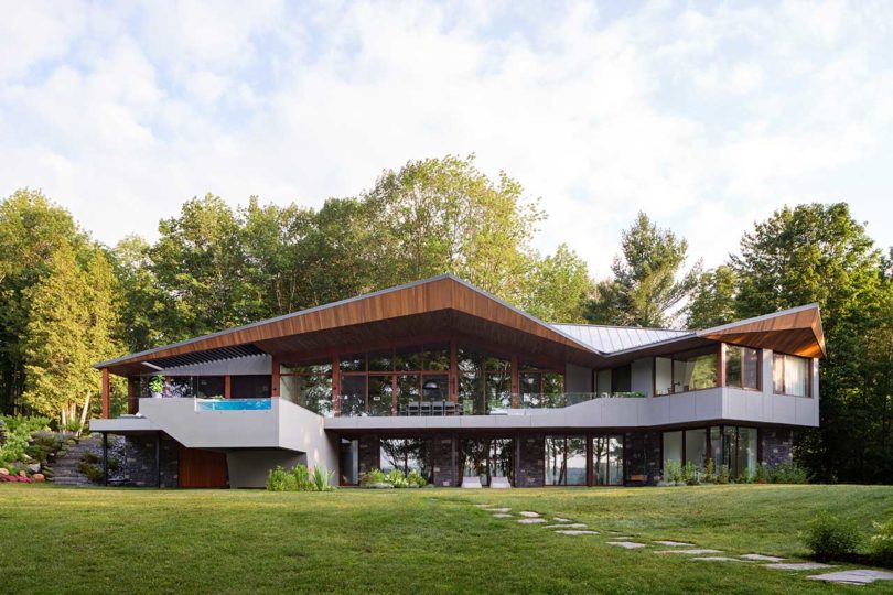 exterior shot of modern angular house with cantilevered pool