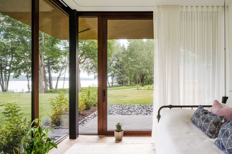 edge of modern bedroom looking out of corner windows