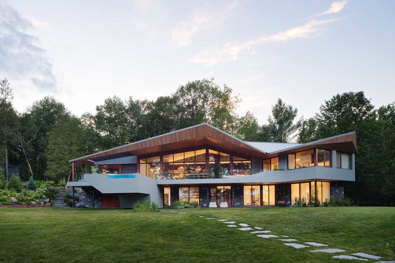 evening view of modern home exterior deck