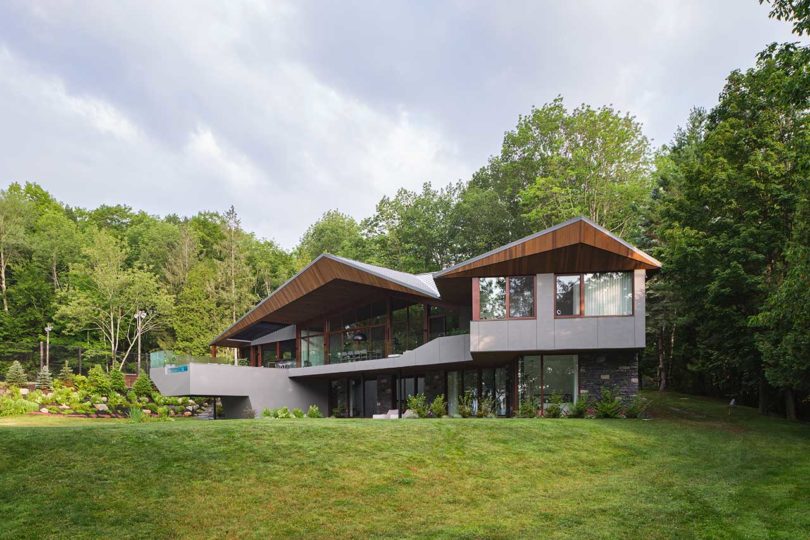 exterior shot of modern angular house with cantilevered pool