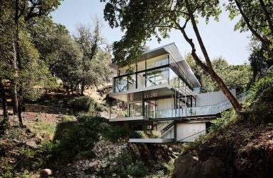 Suspension House Bridges a Creek Between California Hills