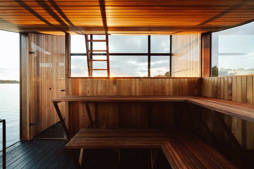 interior of modern wooden floating sauna on water