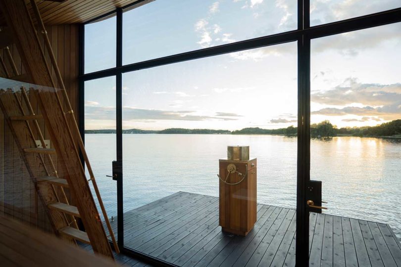 interior of modern wooden floating sauna on water