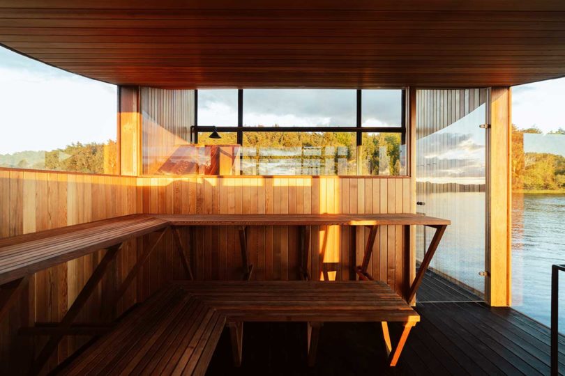 interior of modern wooden floating sauna on water