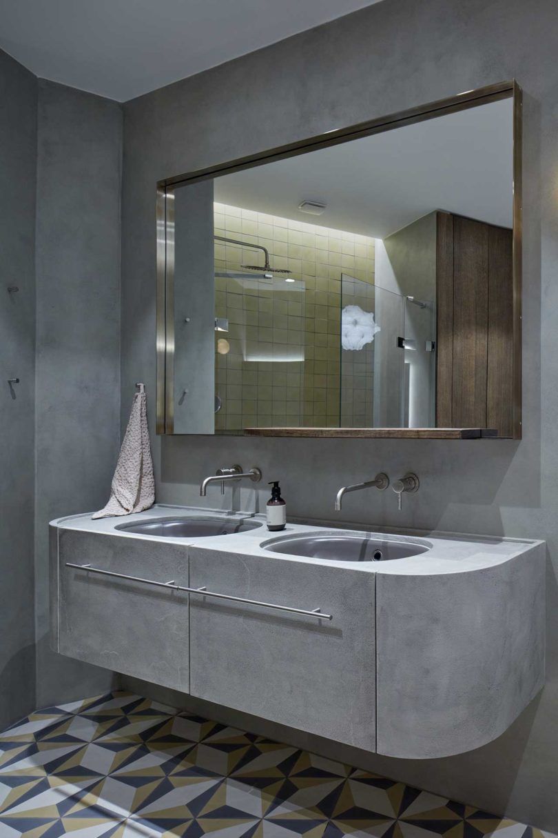 dark gray moody bathroom in modern apartment