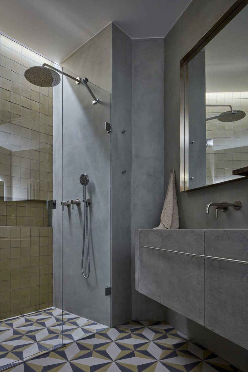 dark gray moody bathroom in modern apartment