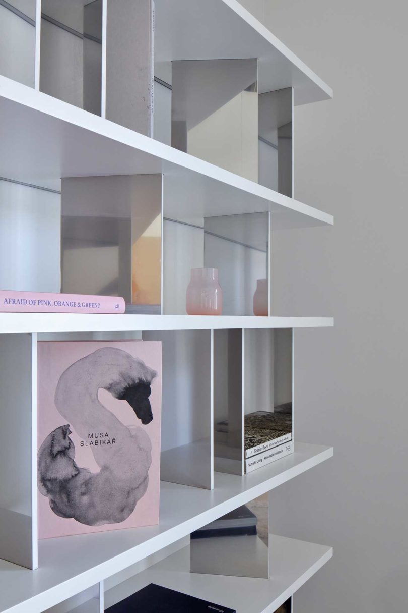 closeup interior view of modern apartment with wall mounted bookshelves