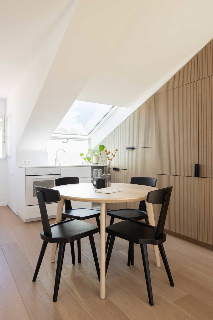 modern attic apartment view into kitchen