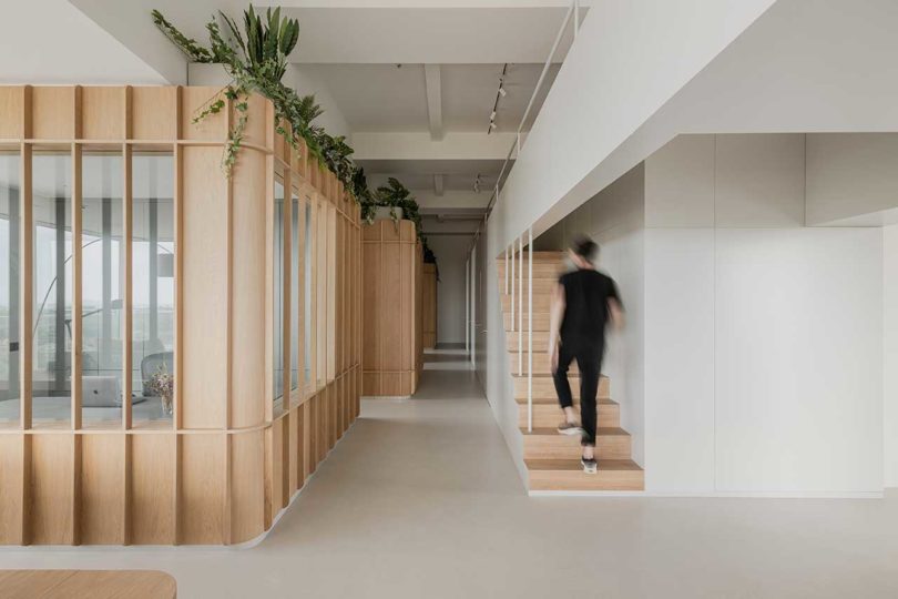 interior view of penthouse with man going up stairs