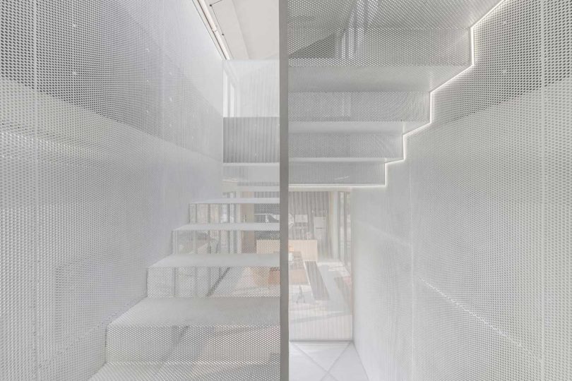 interior shot of modern home closeup of mesh enclosed staircase