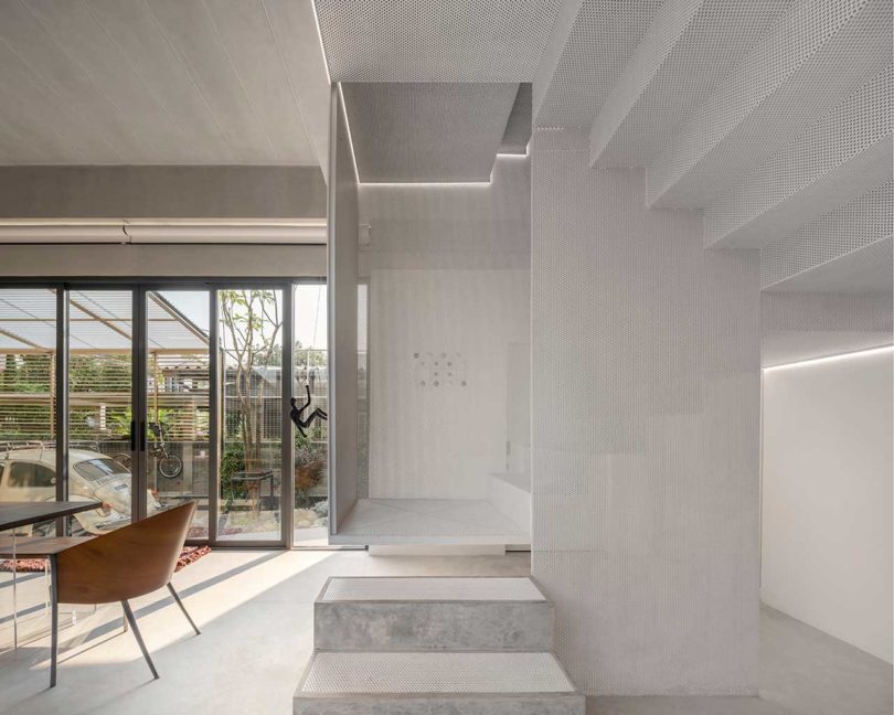 interior shot of modern home closeup of mesh enclosed staircase