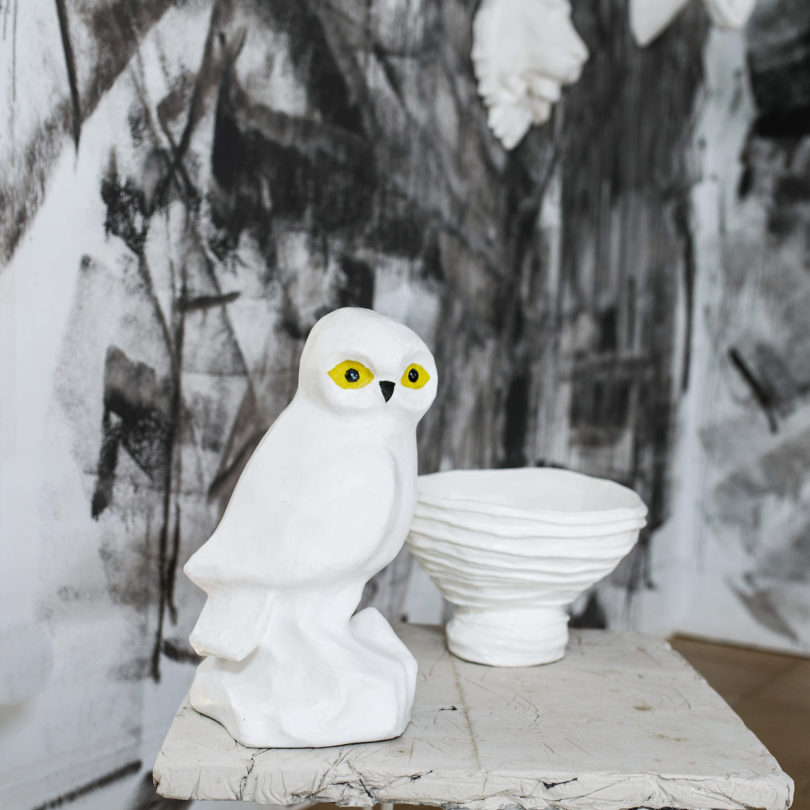 white owl next to white bowl