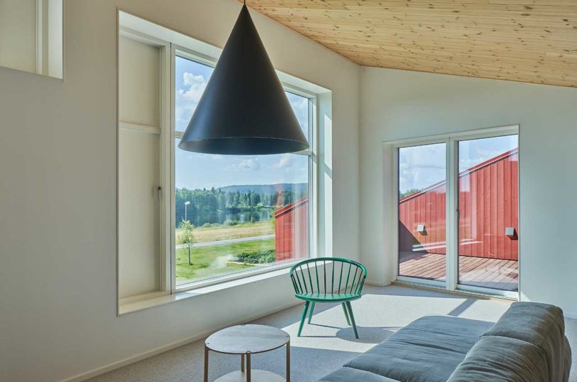 modern living room with large black pendant light