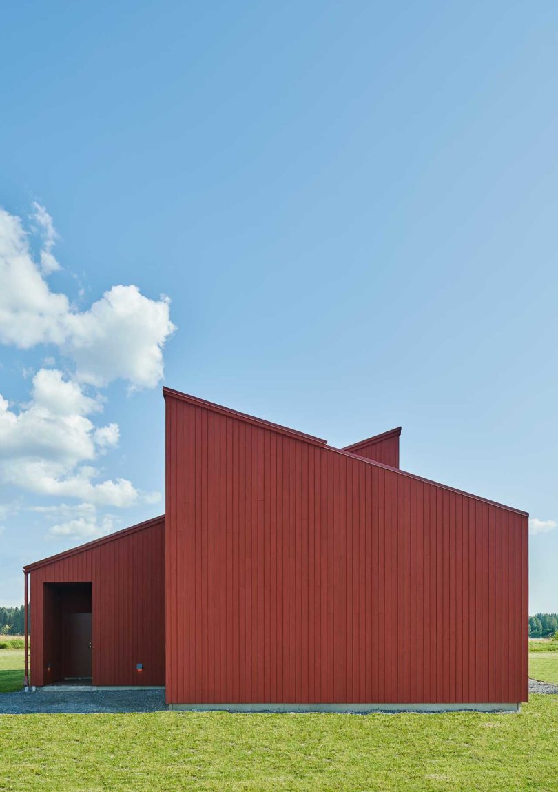 exterior of large modern red house on the end