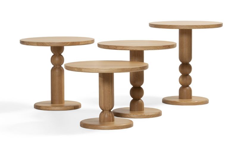 four turned wood side tables on a white background