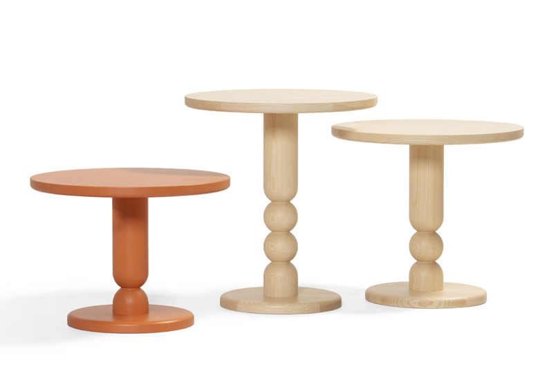 three turned wood side tables on a white background