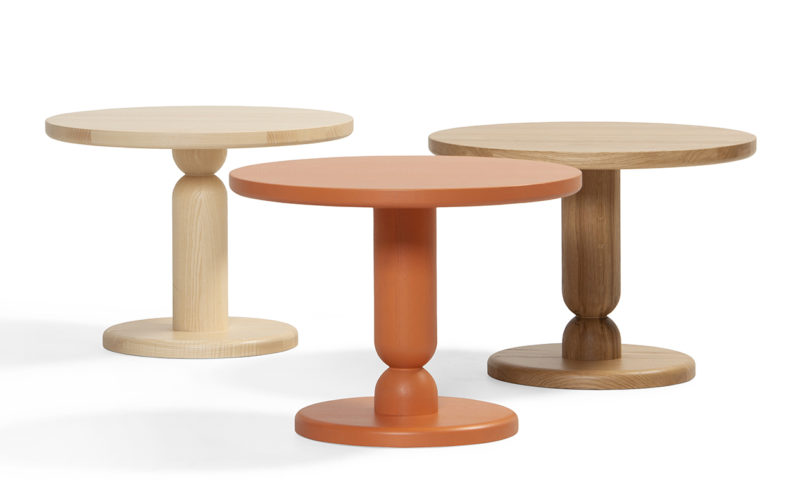 three turned wood side tables on a white background