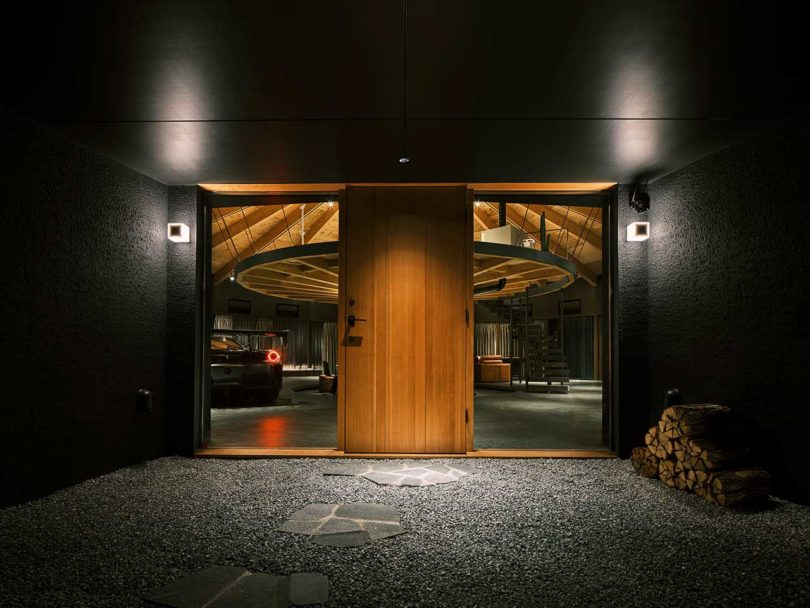 evening view of modern domed home front door