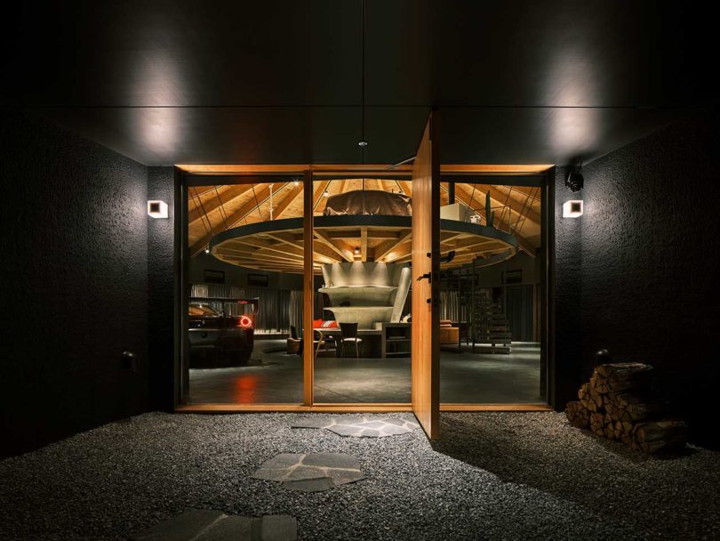 evening view of modern domed home front door with door open