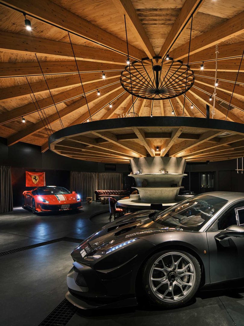 interior of domed modern home with two cars inside