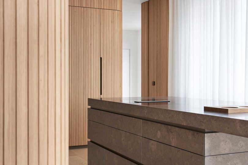 interior shot of modern kitchen with wood slat details