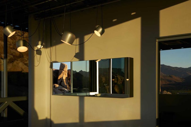 interior shot of modern space with black hanging light pendants