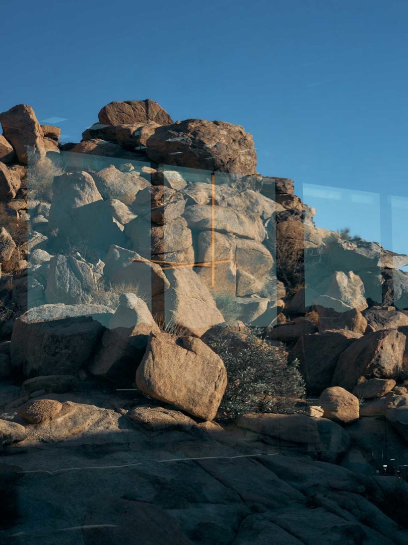 looking through window to the rocky landscape