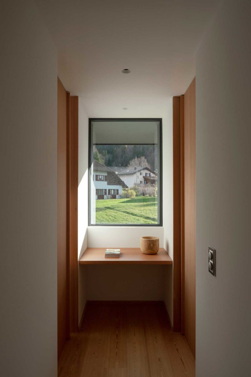 end hallway view of modern house looking out window