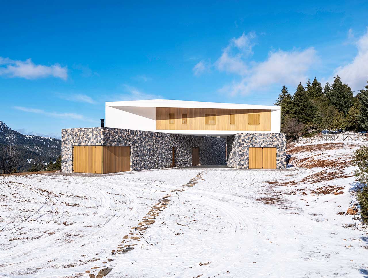 A Greek Mountain House Made of Three Angled Volumes