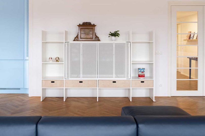 modern interior of living room facing small white tv cabinet