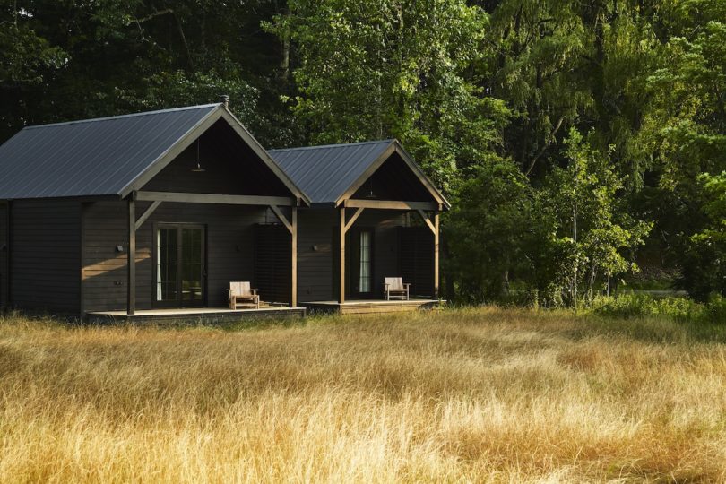 Outdoor deck of an INNESS cabin, blending indoor and outdoor living with comfortable seating