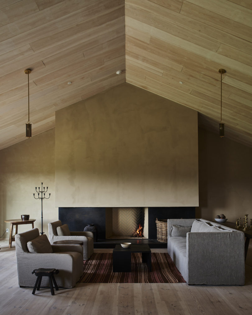 The communal lobby bar at the INNESS farmhouse, adorned with vintage and custom furnishings