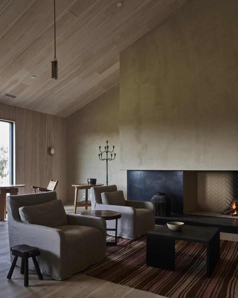 The communal lobby bar at the INNESS farmhouse, adorned with vintage and custom furnishings